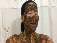Asian woman laughs covered in scat